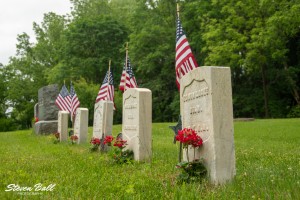 Gravestones with American flags
