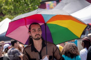 Man with rainbow unbrella
