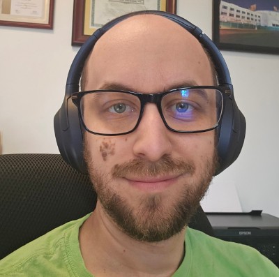 Man wearing glasses and headphones